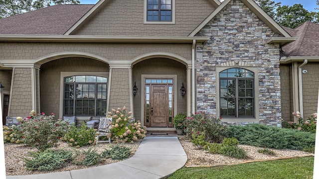 view of front of home featuring metal roof, a garage, driveway, a front lawn, and a standing seam roof