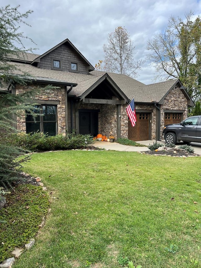 view of front of home with a garage and a front lawn