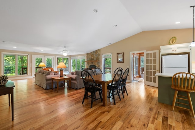76 Misty River Ln, Hayesville, NC 28904 - dining area with a ceiling fan, lofted ceiling, light wood finished floors, a stone fireplace, and recessed lighting