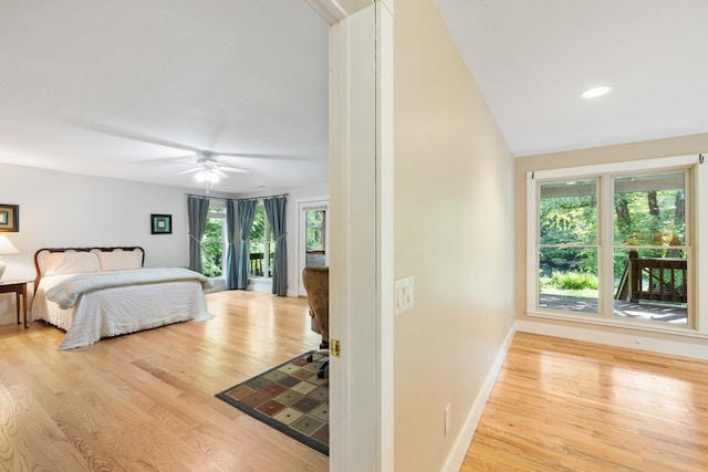 76 Misty River Ln, Hayesville, NC 28904 - bedroom featuring multiple windows, wood finished floors, and ceiling fan