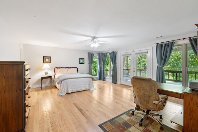 76 Misty River Ln, Hayesville, NC 28904 - bedroom with access to exterior, french doors, light wood-style flooring, a ceiling fan, and a desk