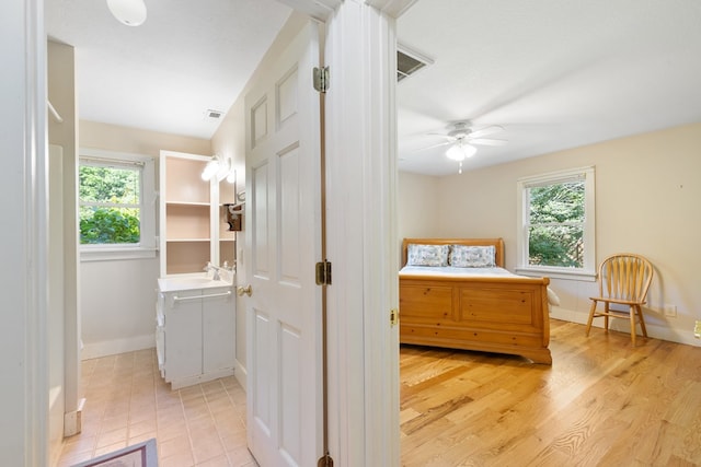 76 Misty River Ln, Hayesville, NC 28904 - bedroom with a ceiling fan and light wood-style flooring