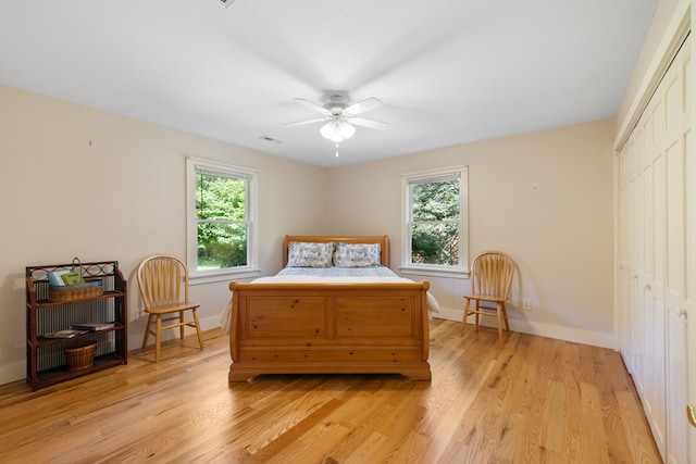 76 Misty River Ln, Hayesville, NC 28904 - bedroom with light wood finished floors, a closet, and a ceiling fan