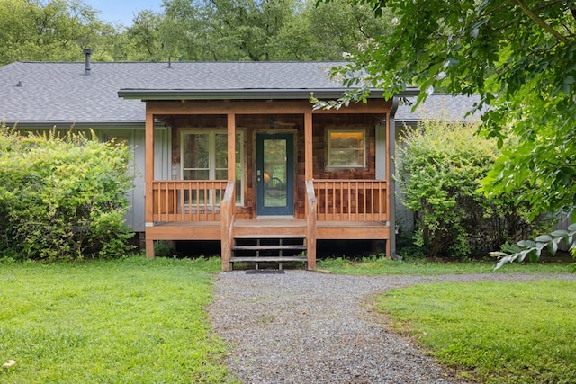 76 Misty River Ln, Hayesville, NC 28904 - view of front of house with a shingled roof, a front yard, and covered porch