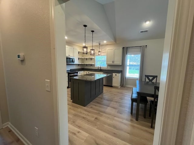 28 Arlington St, Hayesville, NC 28904 - kitchen with appliances with stainless steel finishes, dark countertops, light wood-type flooring, white cabinetry, and recessed lighting
