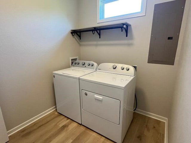 28 Arlington St, Hayesville, NC 28904 - laundry area featuring electric panel, washer and clothes dryer, and light wood-style flooring