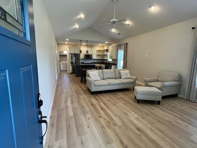 28 Arlington St, Hayesville, NC 28904 - living room featuring washer / clothes dryer, a ceiling fan, light wood-type flooring, high vaulted ceiling, and recessed lighting