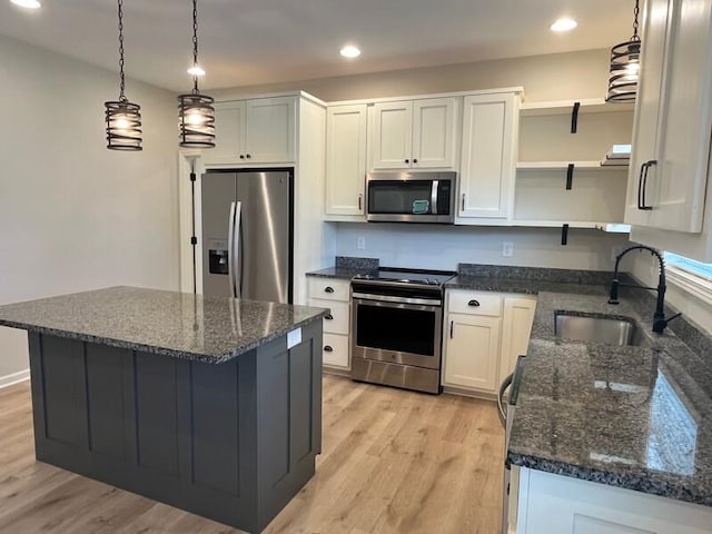28 Arlington St, Hayesville, NC 28904 - kitchen with appliances with stainless steel finishes, light wood-style floors, dark stone countertops, white cabinets, and recessed lighting