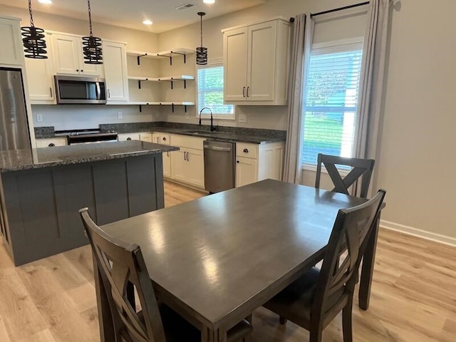 28 Arlington St, Hayesville, NC 28904 - kitchen featuring appliances with stainless steel finishes, light wood-style floors, white cabinetry, and recessed lighting