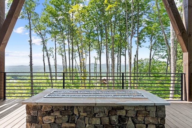 exterior space featuring a mountain view and a fire pit