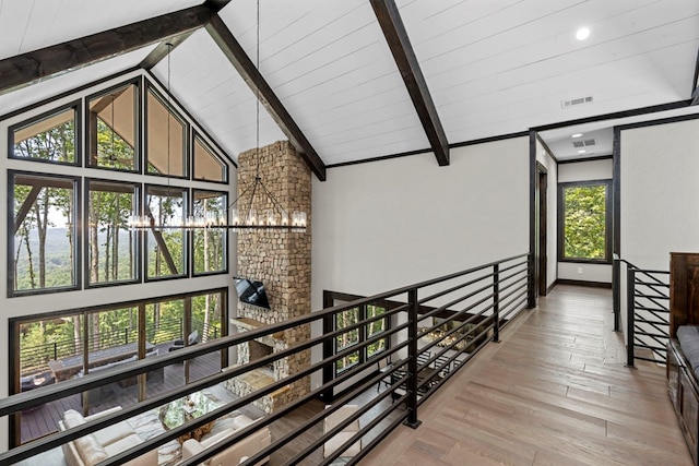 hallway with wood ceiling, lofted ceiling with beams, a chandelier, and wood-type flooring