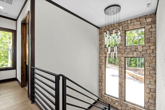 interior space with crown molding and hardwood / wood-style floors