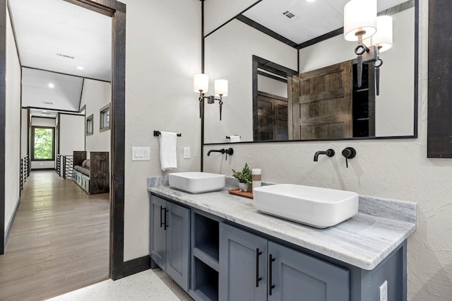 bathroom with vanity and hardwood / wood-style floors