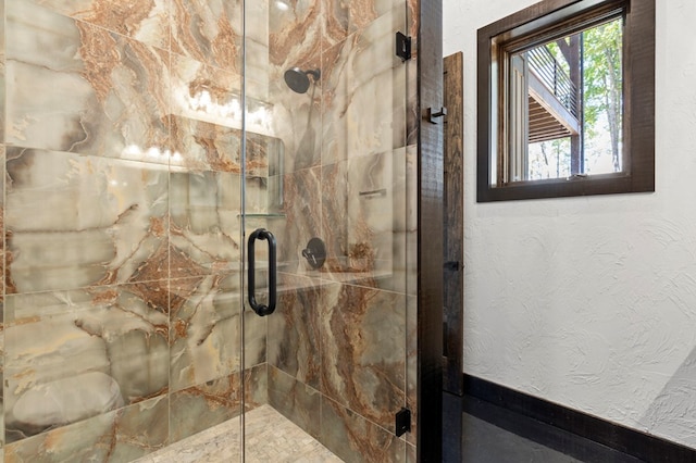 bathroom featuring an enclosed shower