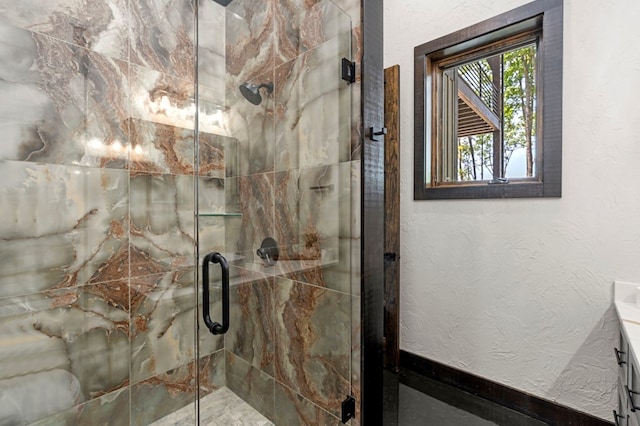 bathroom with vanity and an enclosed shower