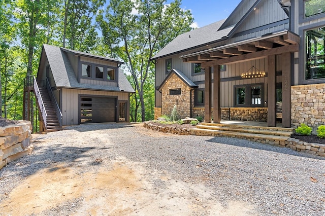 view of front of home featuring covered porch and a garage