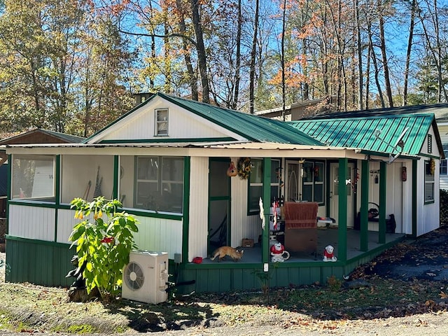 back of property featuring ac unit