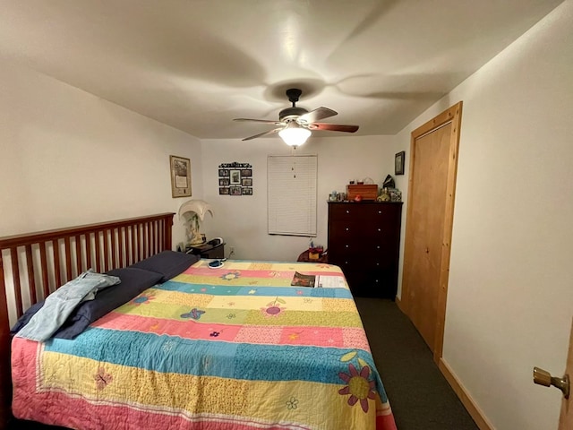 carpeted bedroom featuring ceiling fan