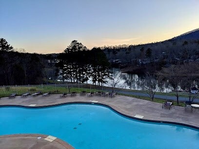 view of pool at dusk