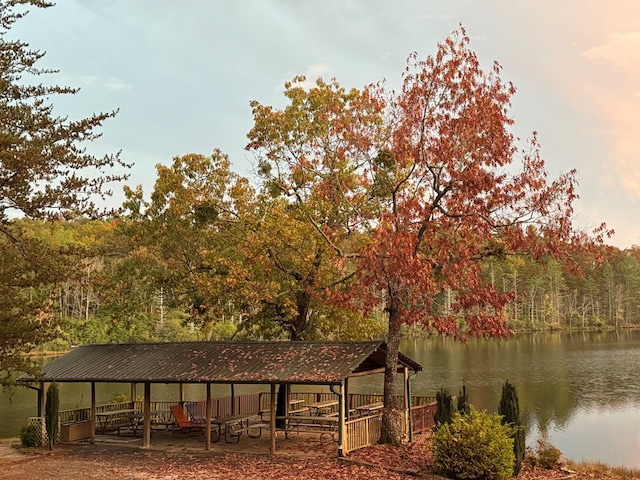 surrounding community with a water view