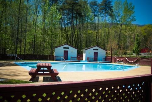 view of swimming pool featuring an outdoor structure