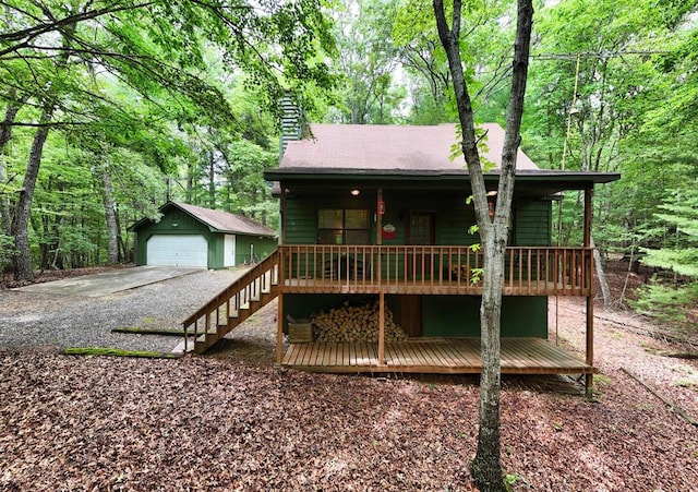 119 Blair Oaks Dr, Blairsville, GA 30512 - view of front of home with a garage, an outbuilding, a chimney, and a porch