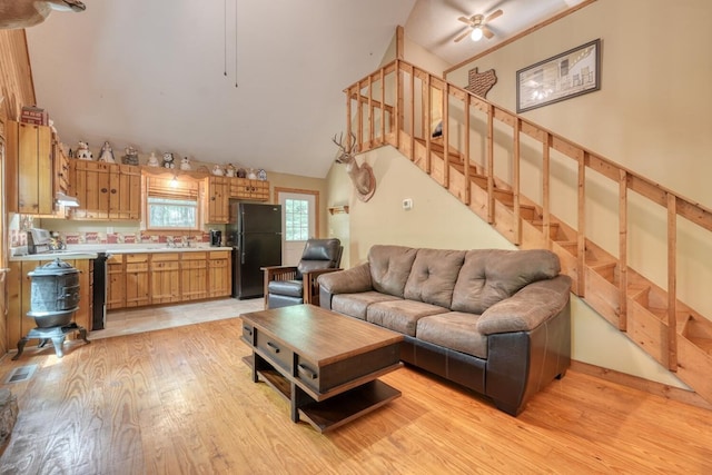 119 Blair Oaks Dr, Blairsville, GA 30512 - living room featuring light wood-style floors, stairway, ceiling fan, and vaulted ceiling
