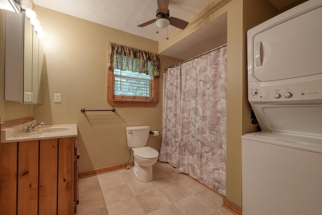 119 Blair Oaks Dr, Blairsville, GA 30512 - full bath featuring stacked washer and clothes dryer, a ceiling fan, vanity, a textured ceiling, and a shower with shower curtain