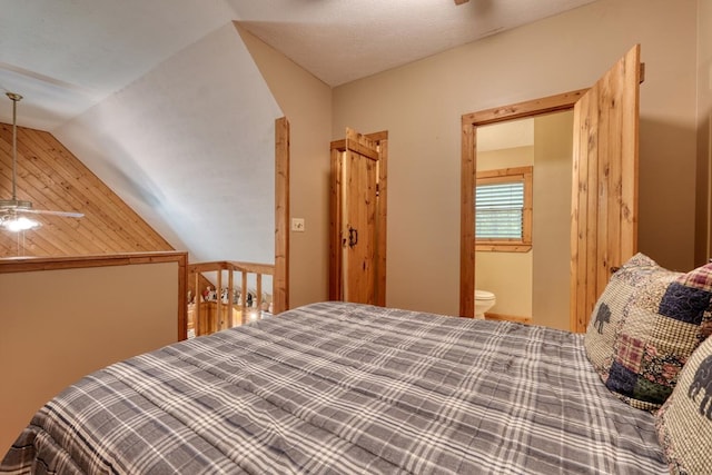 119 Blair Oaks Dr, Blairsville, GA 30512 - bedroom with lofted ceiling, wooden walls, ensuite bathroom, and a ceiling fan