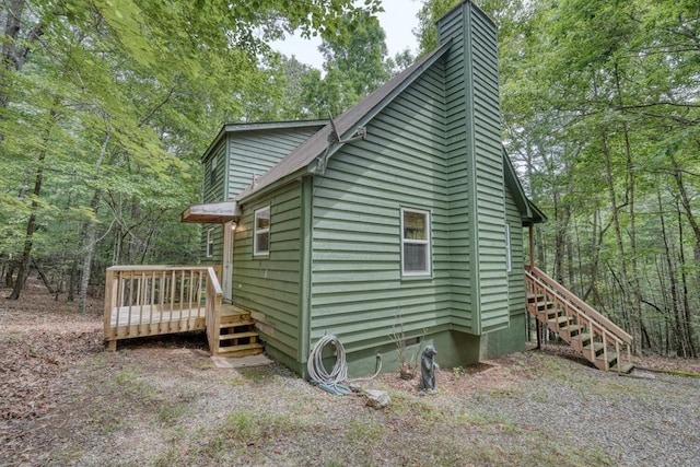 119 Blair Oaks Dr, Blairsville, GA 30512 - view of property exterior with a chimney, a wooden deck, stairway, and a wooded view