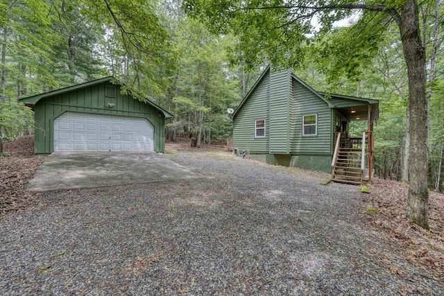 119 Blair Oaks Dr, Blairsville, GA 30512 - view of home's exterior with a detached garage, an outbuilding, stairs, and board and batten siding