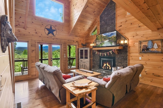 living room with hardwood / wood-style flooring, wooden ceiling, and high vaulted ceiling