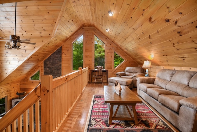 living room with wood ceiling, wood walls, and hardwood / wood-style flooring