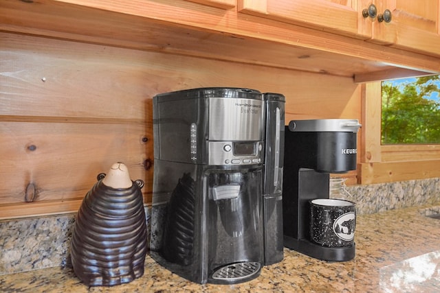 details with light stone counters and wooden walls