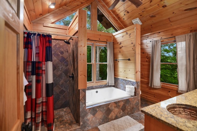 bathroom featuring plenty of natural light, wooden ceiling, and wooden walls