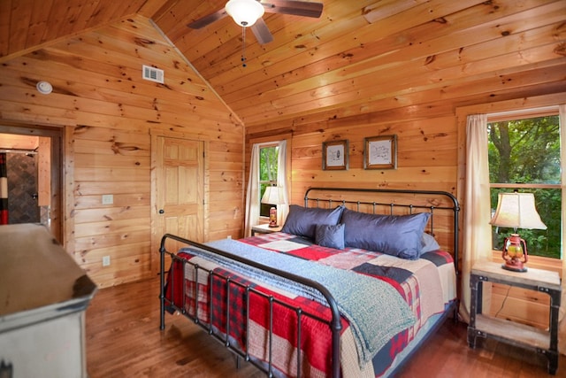 bedroom featuring multiple windows, wood ceiling, and dark hardwood / wood-style flooring