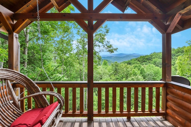 wooden terrace featuring a mountain view