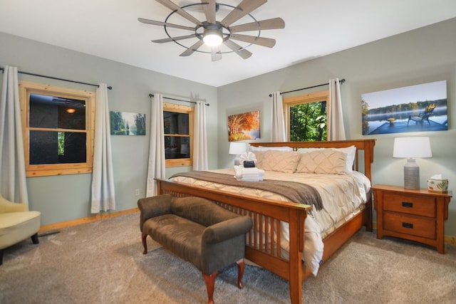 carpeted bedroom with a ceiling fan