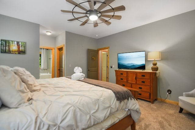bedroom featuring light carpet, baseboards, connected bathroom, and ceiling fan