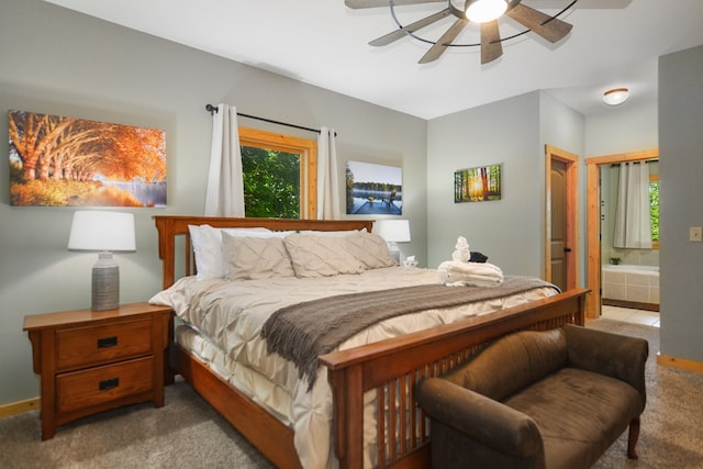 carpeted bedroom featuring ensuite bathroom and ceiling fan