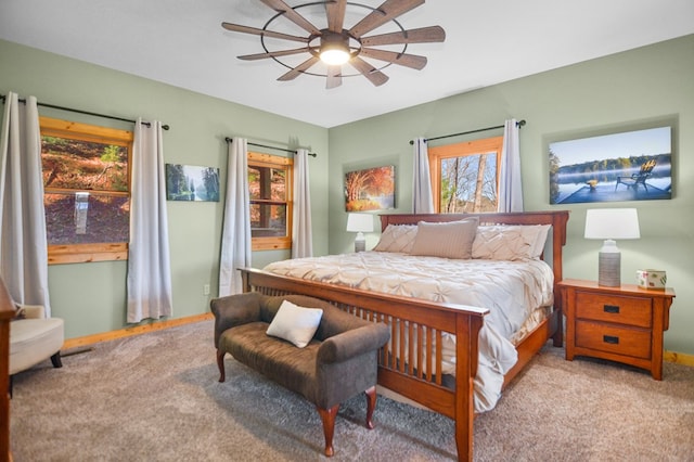 bedroom with carpet, ceiling fan, and baseboards