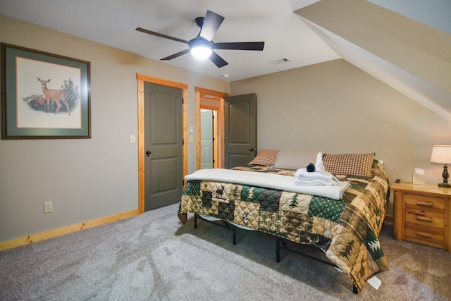 carpeted bedroom with a ceiling fan and baseboards