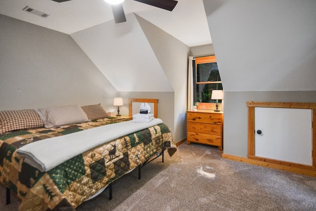 bedroom featuring vaulted ceiling, carpet, and a ceiling fan