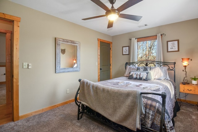 carpeted bedroom with baseboards and a ceiling fan
