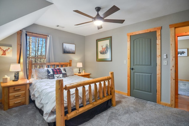 bedroom with carpet floors, baseboards, a ceiling fan, and vaulted ceiling
