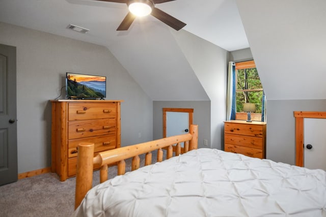 carpeted bedroom with lofted ceiling, ceiling fan, and baseboards