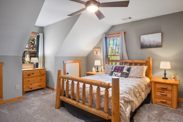 carpeted bedroom with lofted ceiling, baseboards, and ceiling fan