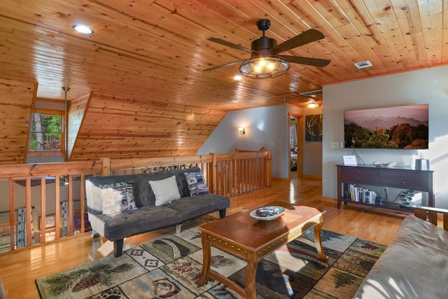 living area with wood ceiling, ceiling fan, wood finished floors, and vaulted ceiling