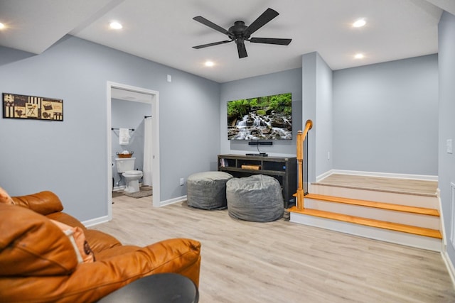 living area featuring baseboards, wood finished floors, recessed lighting, and a ceiling fan