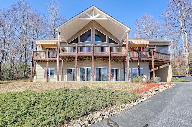 back of house featuring a deck